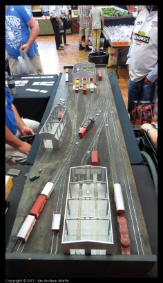 Image 1: Looking from the pit-road shed end, you can see the entirety of the layout. Note the car cards on the far table